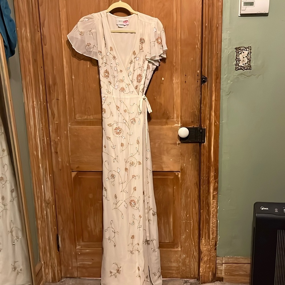 BHLDN Plymouth dress in cream/pinkish hue.